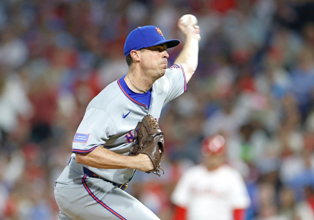 Mets pitcher Brooks Raley talking with teammates
