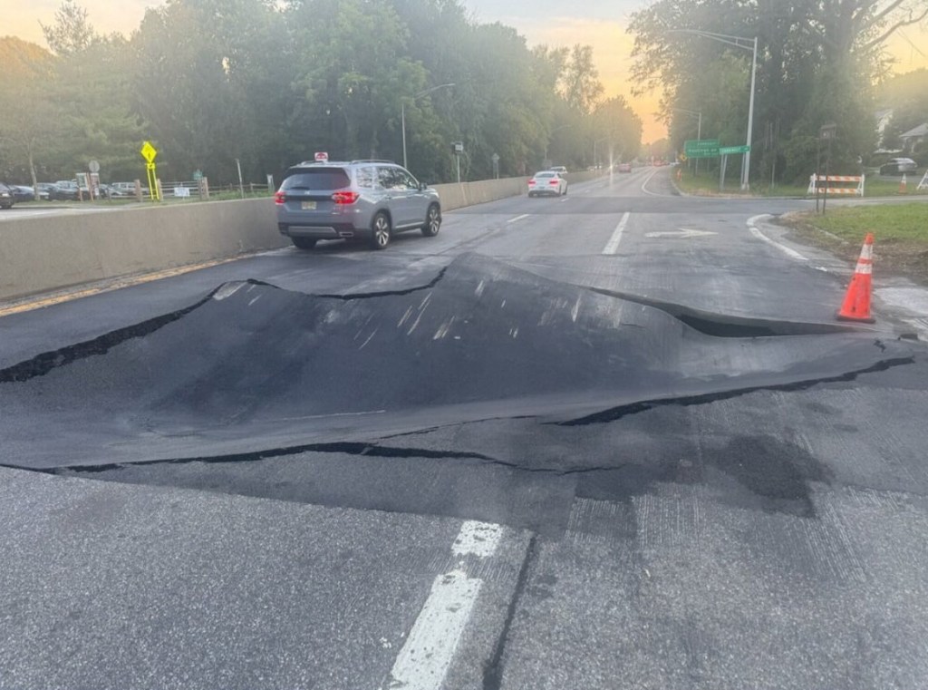 buckled pavement close-up