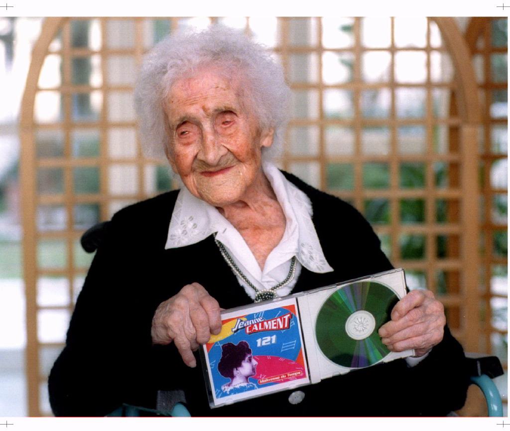 Elderly woman holding a compact