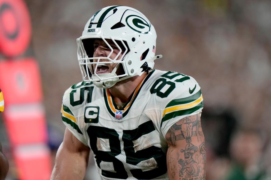 Commanders and Packers players on the field