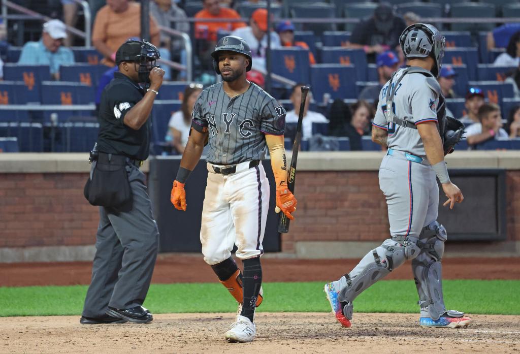Cedric Mullins reacts after he strikes out swinging with two runners on during the ninth inning
