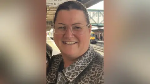 Commuters waiting on a station platform