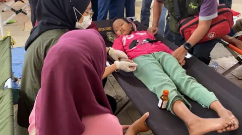 Indonesia’s free school lunch program faces mass illness as cases surpass 1,000