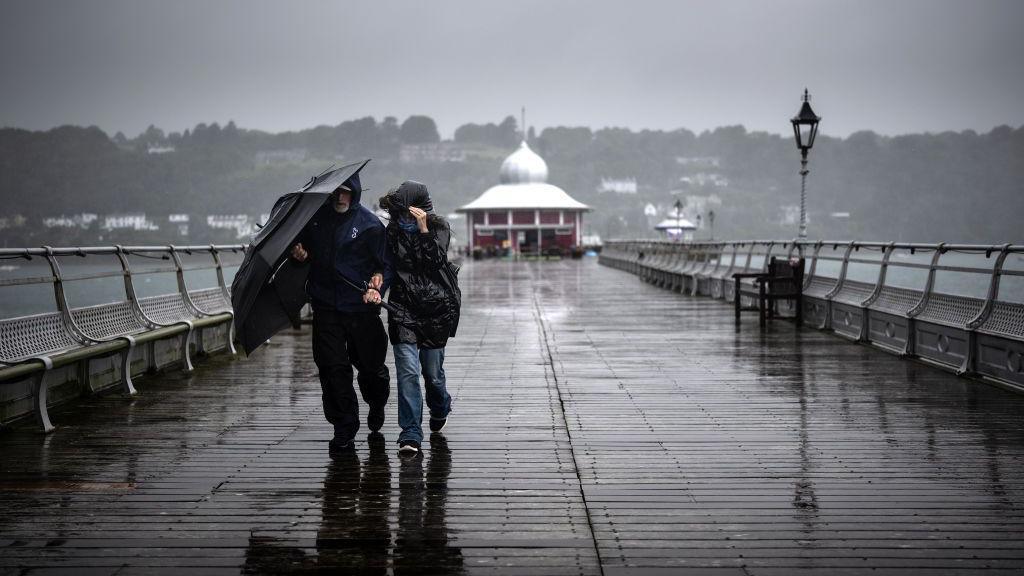 Yellow wind warning as stormy weather brings heavy rain and gales to much of UK