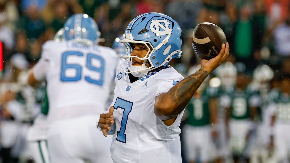 UNC quarterback Gio Lopez looks to pass