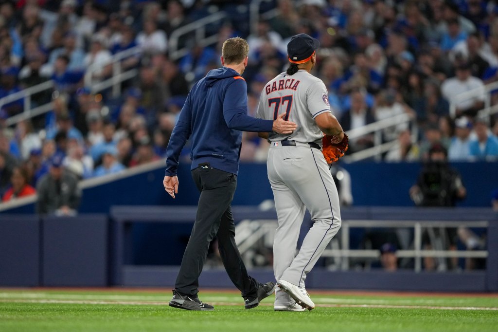 Garcia walks off the field after being removed in the second inning