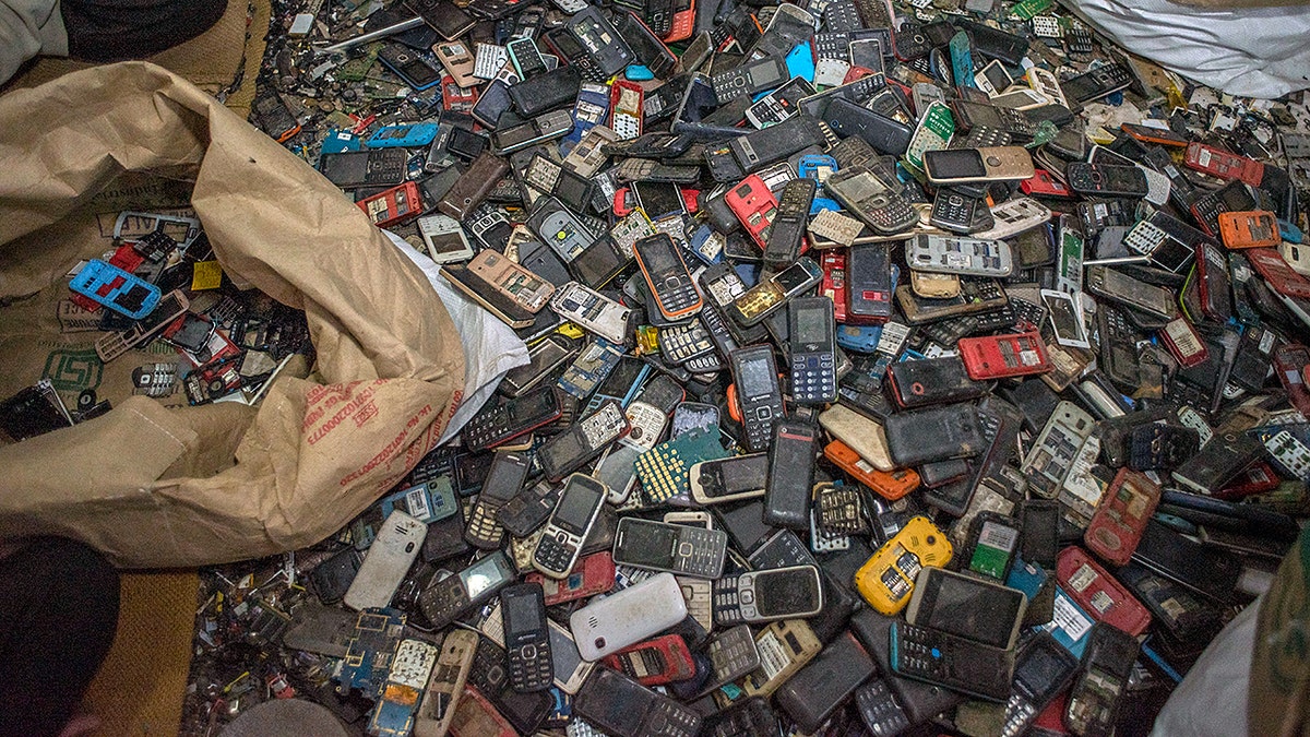 discarded cell phones awaiting recycling