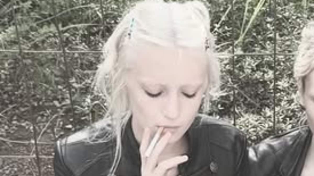 Naomi Watts' daughter Kai Schreiber, 16, photographed smoking after Milan Fashion Week show