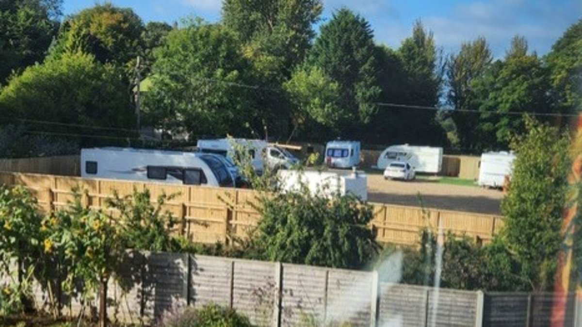 Surrey village braces as unauthorised traveller encampment expands after plots go on sale for £25,000