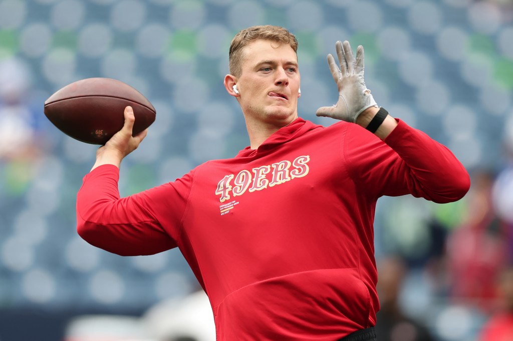 Mac Jones warms up prior to the game against the Seahawks