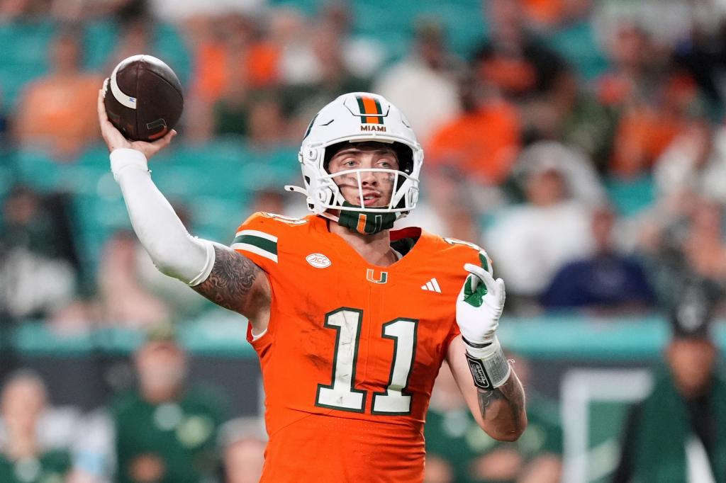 Miami quarterback Carson Beck looks to pass