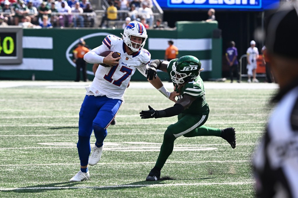 Jets linebacker pursues Bills quarterback on a scramble during the Bills-Jets game on Sept. 14, 2025.