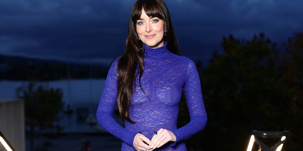 Dakota Johnson wears sheer blue Gucci gown braless at Zurich Film Festival, receives Golden Eye Award