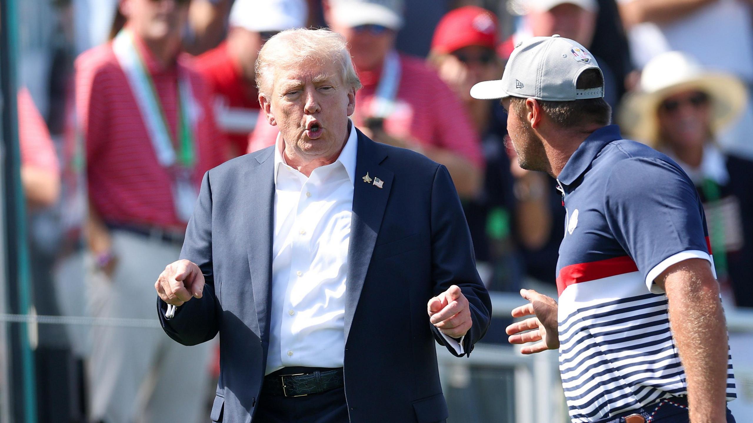 Trump arrives at Ryder Cup amid partisan atmosphere
