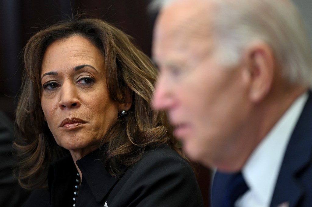 Harris listens to Biden