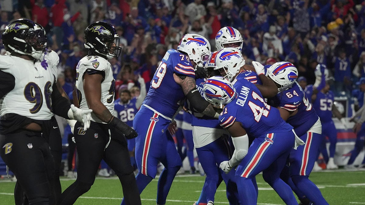 Bills kicker Matt Prater surrounded by teammates after the game-winning field goal