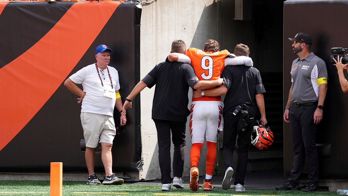 Burrow is helped off the field after suffering the injury