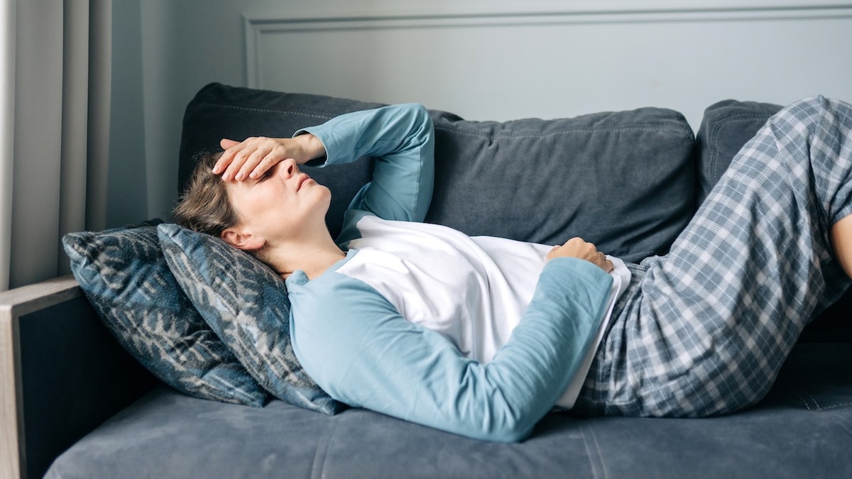 Woman on couch fatigued