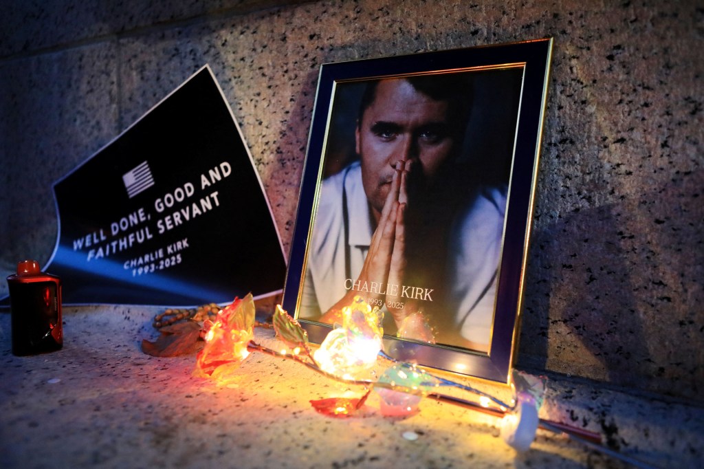 Objects placed near image at a prayer vigil