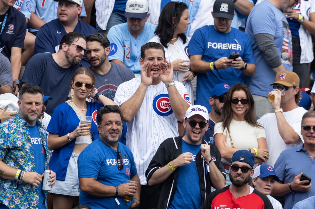 Rizzo cheers from the bleachers
