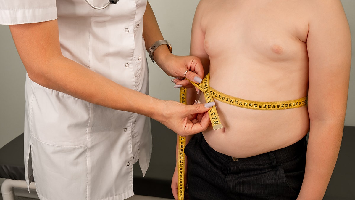 Young patient with doctor, illustrating rising childhood obesity