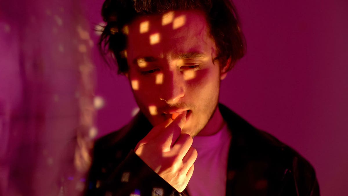 People seated in a clinical monitoring room