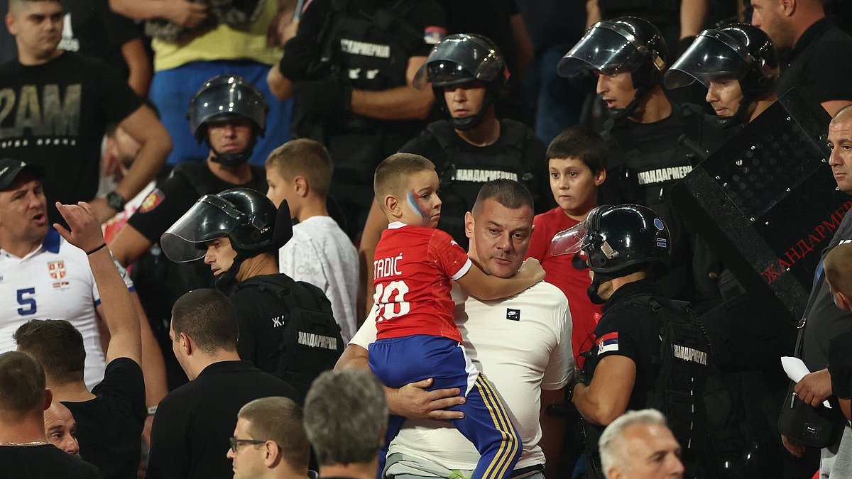 Riot police rush into stands as Serbia fans fight during England’s 5-0 win in Belgrade