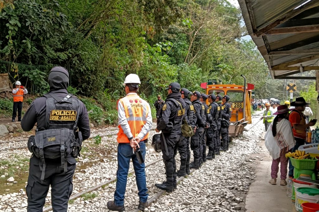 Police guard trains near Machu Picchu tracks