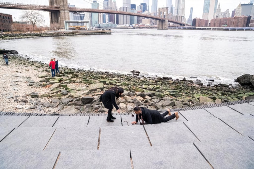 Man dropping ring bk bridge