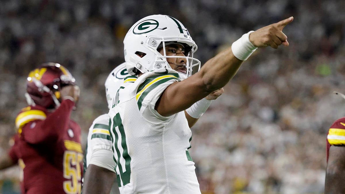 Jordan Love celebrates a first down