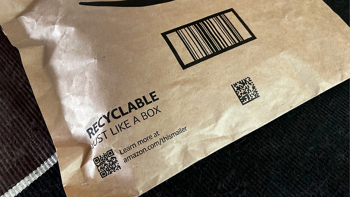 Amazon-style package showing QR code label