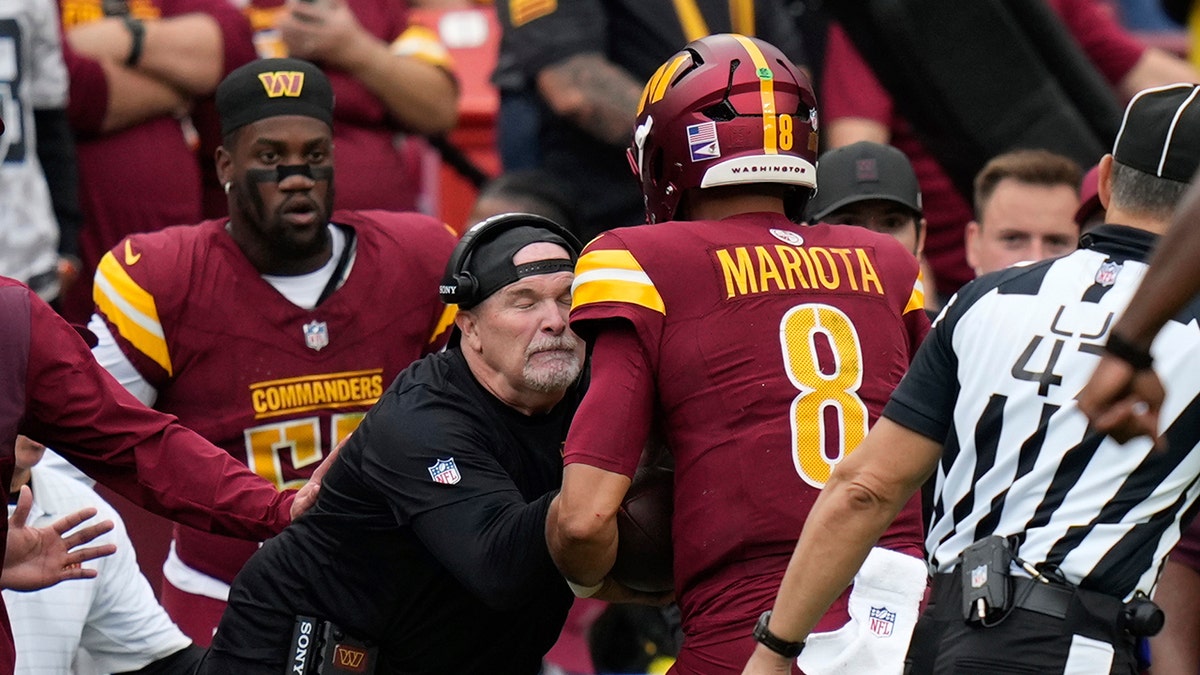 Commanders coach Dan Quinn bloodied after collision with Marcus Mariota during win over Raiders