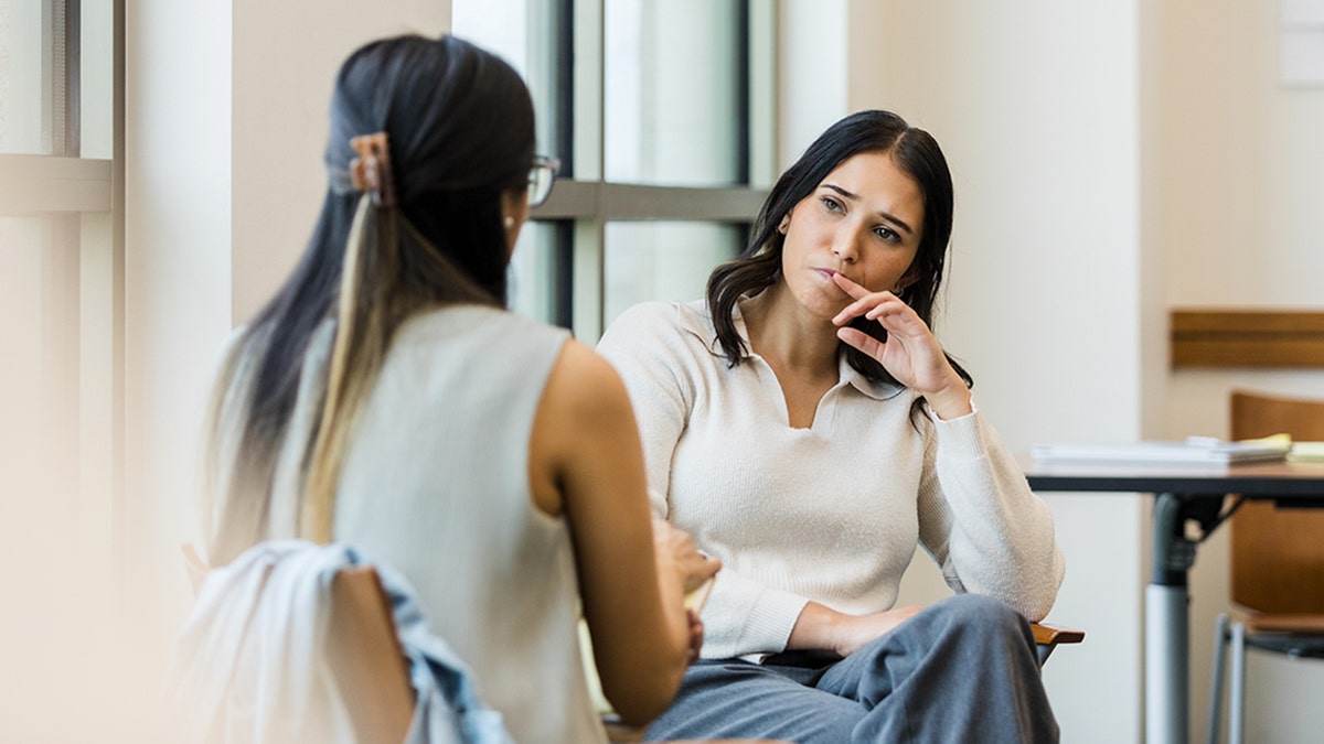 Therapist with client