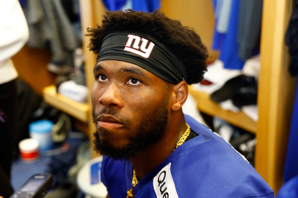 Giants running back advancing through traffic