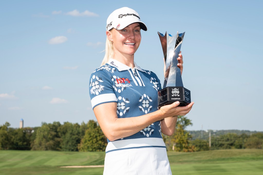 Charley Hull holds trophy