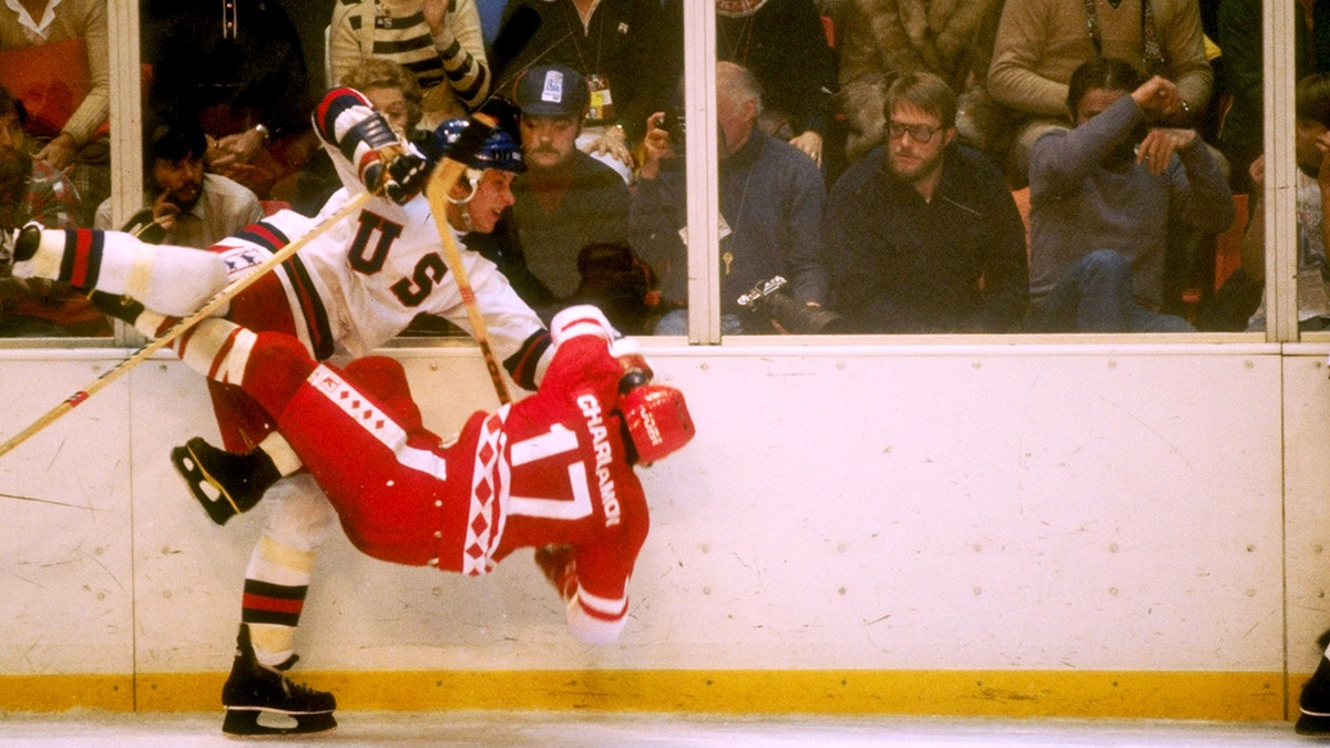 Mike Eruzione participates in a ceremonial puck drop commemorating the 40th anniversary of the "Miracle on Ice" at T-Mobile Arena in 2020