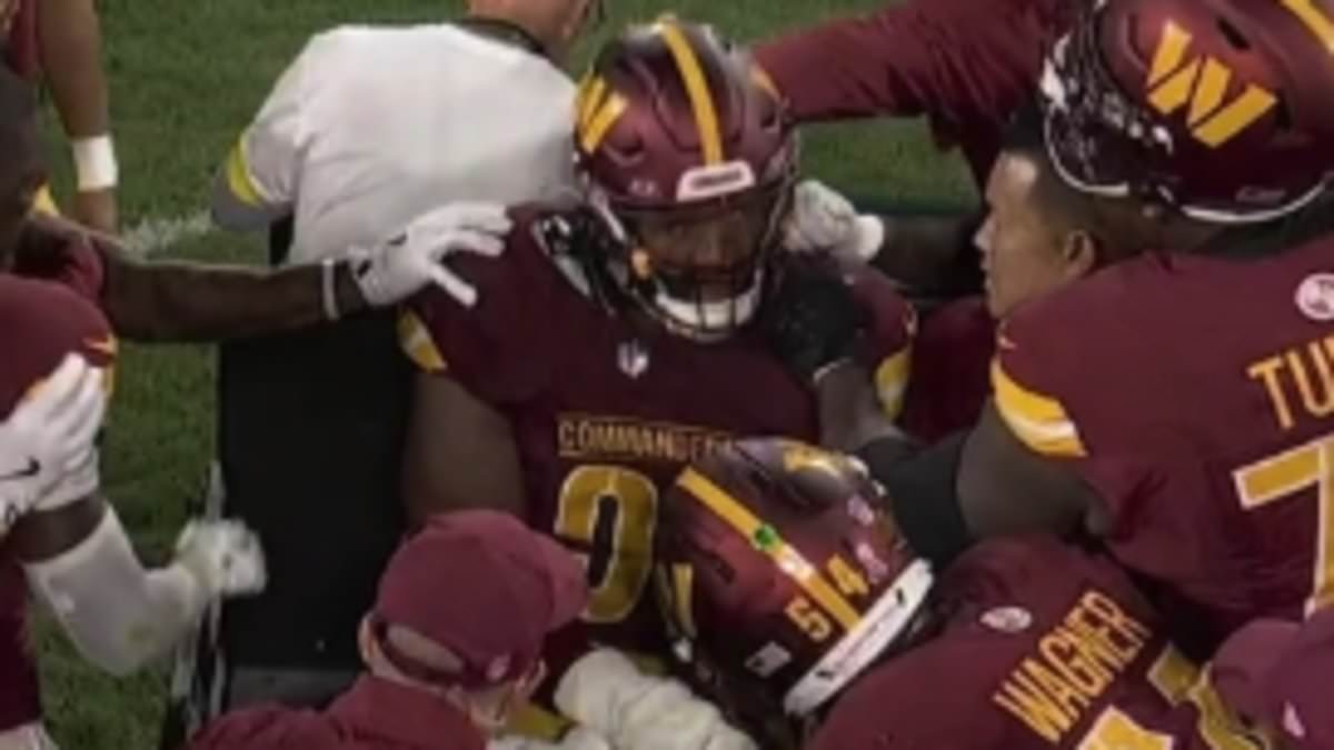 Commanders' Deatrich Wise carted off after leg injury against Packers