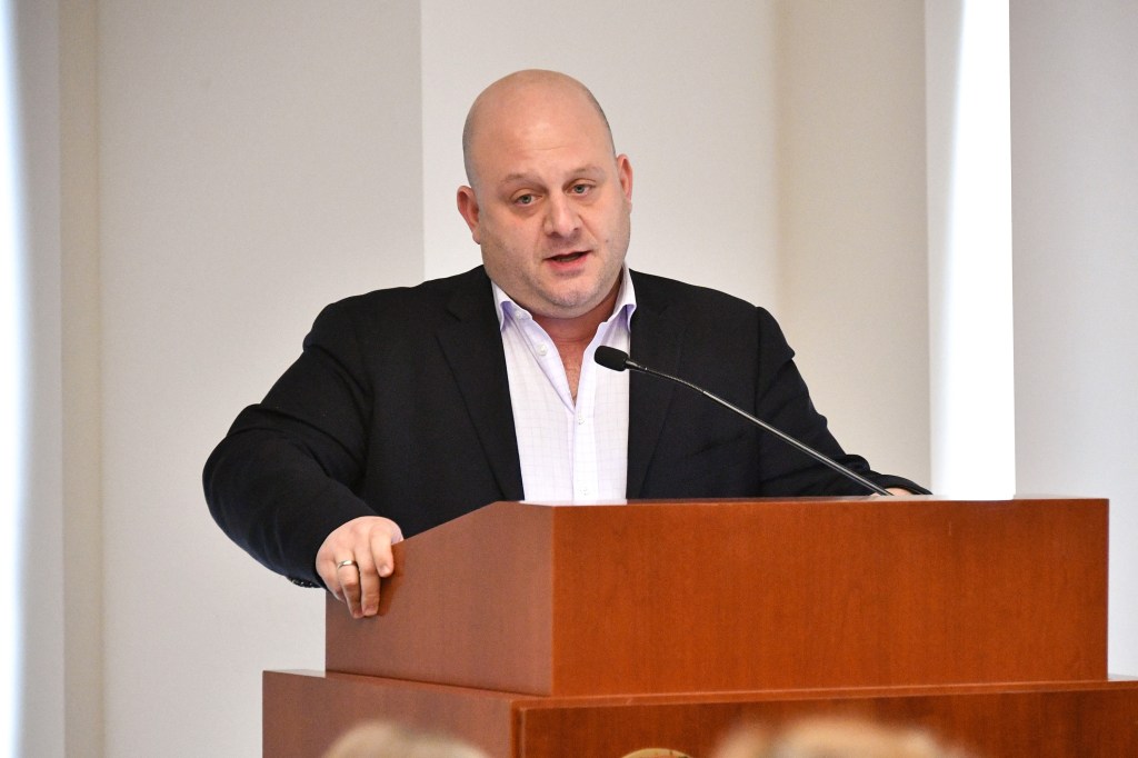 James Mallios speaks at a press event