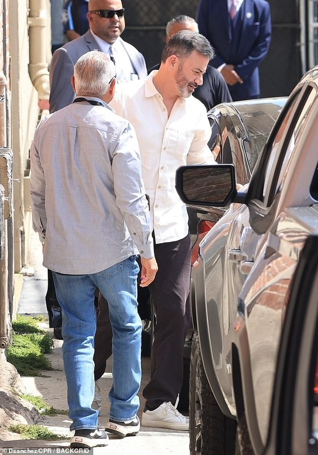 Glen Powell and Sarah McLachlan outside the studio