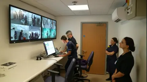 Staff operate equipment in the simulation laboratory