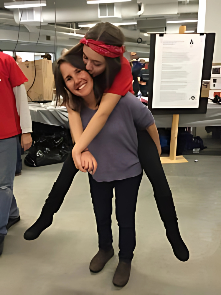 Deb Schmill at robotics competition with Becca