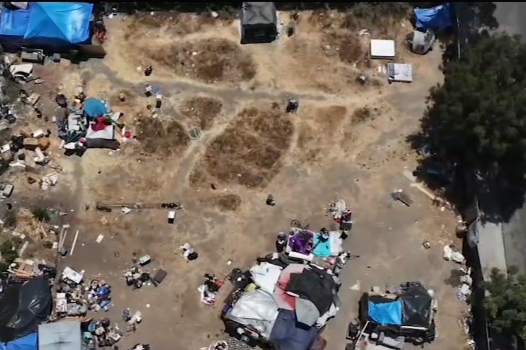 Makeshift shelters and tarps on a vacant Koreatown lot