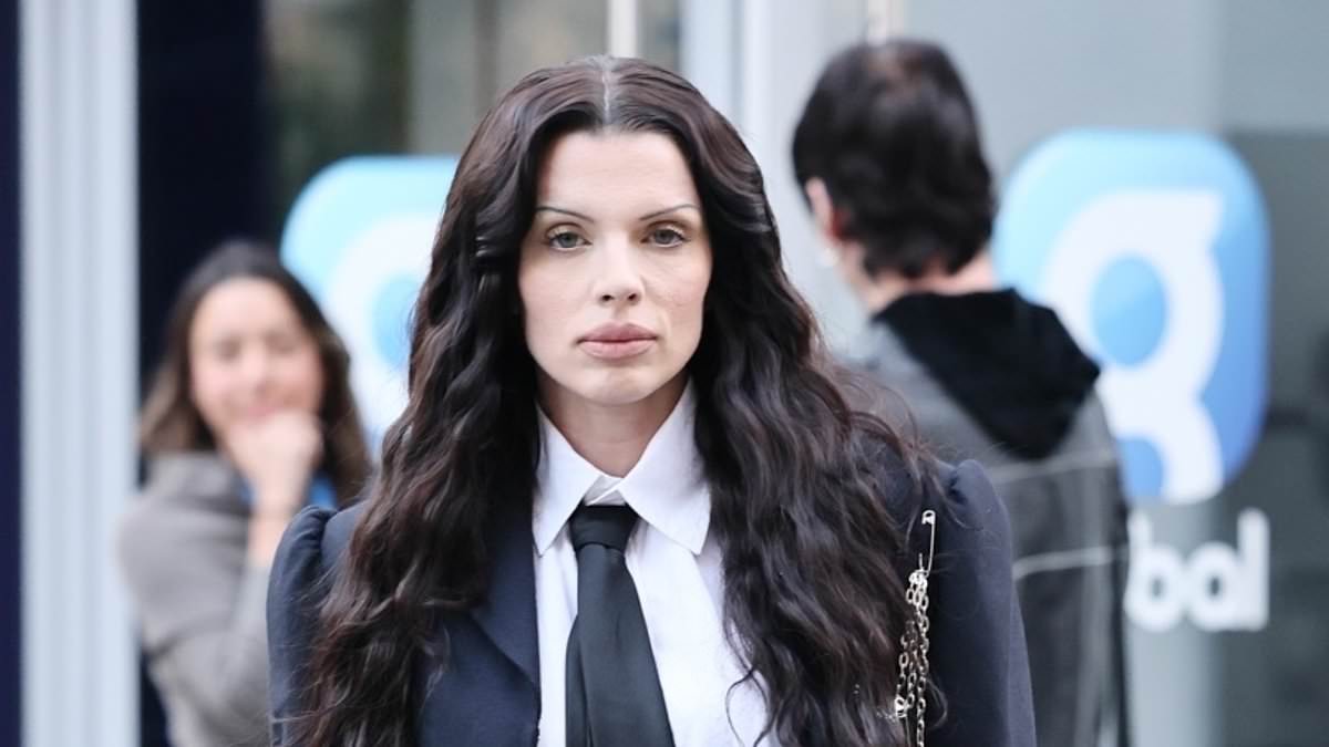 Julia Fox rocks gothic preppy chic at Capital Radio in London as baptism feud with ex unfolds