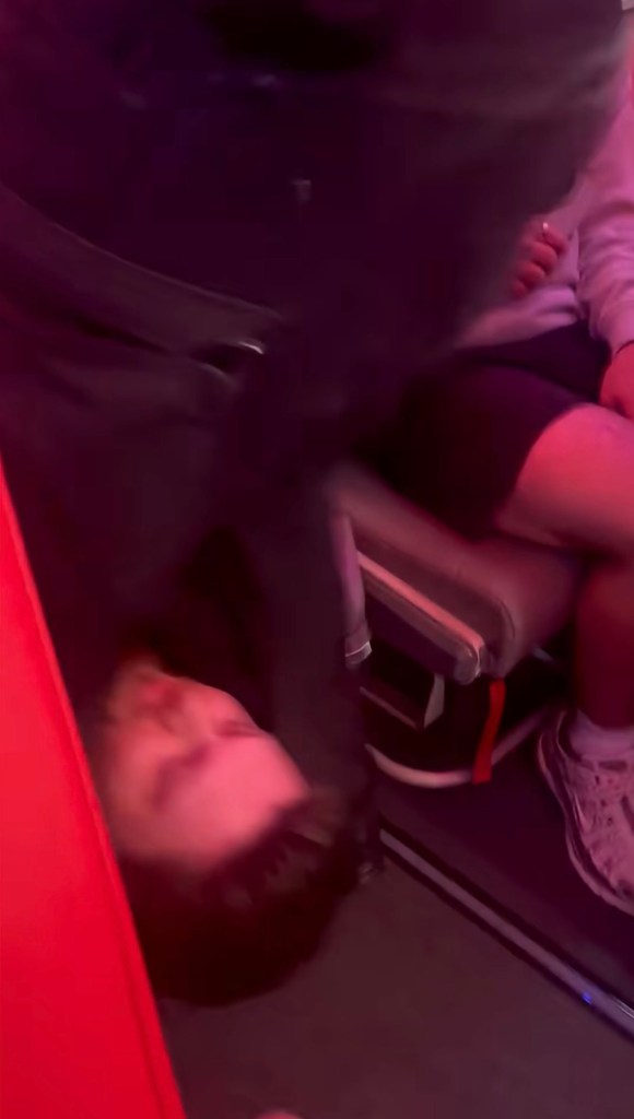 Authorities escorting passenger off the aircraft