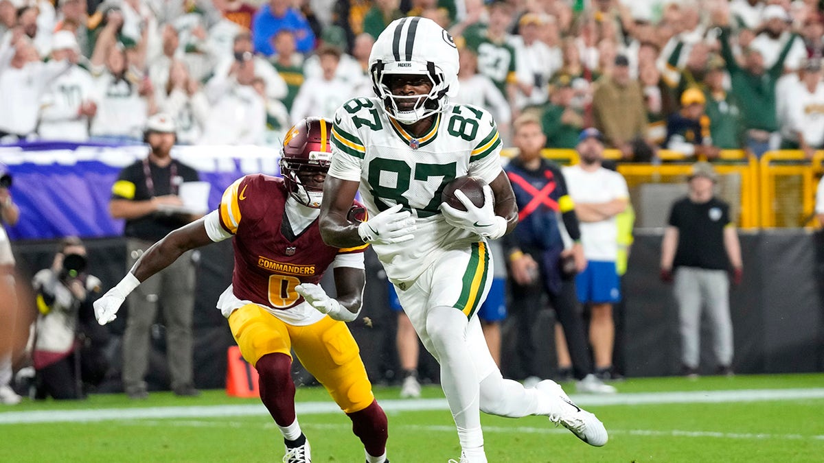 Romeo Doubs scores against the Commanders