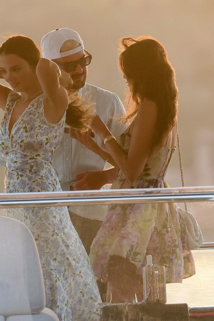 Nina Dobrev in a floral sundress on board the yacht