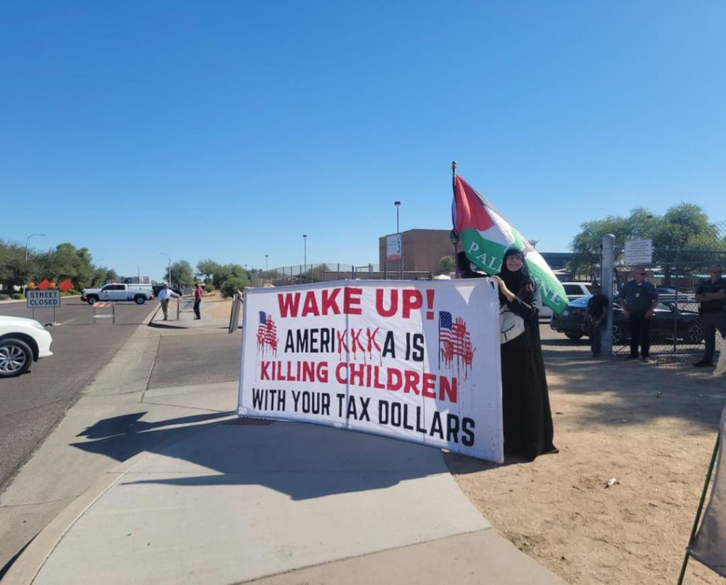 Crowd outside funeral with protesters