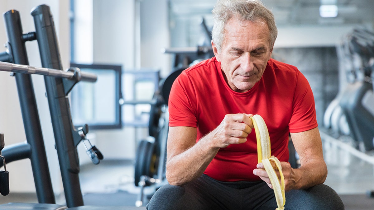 Man peeling a banana