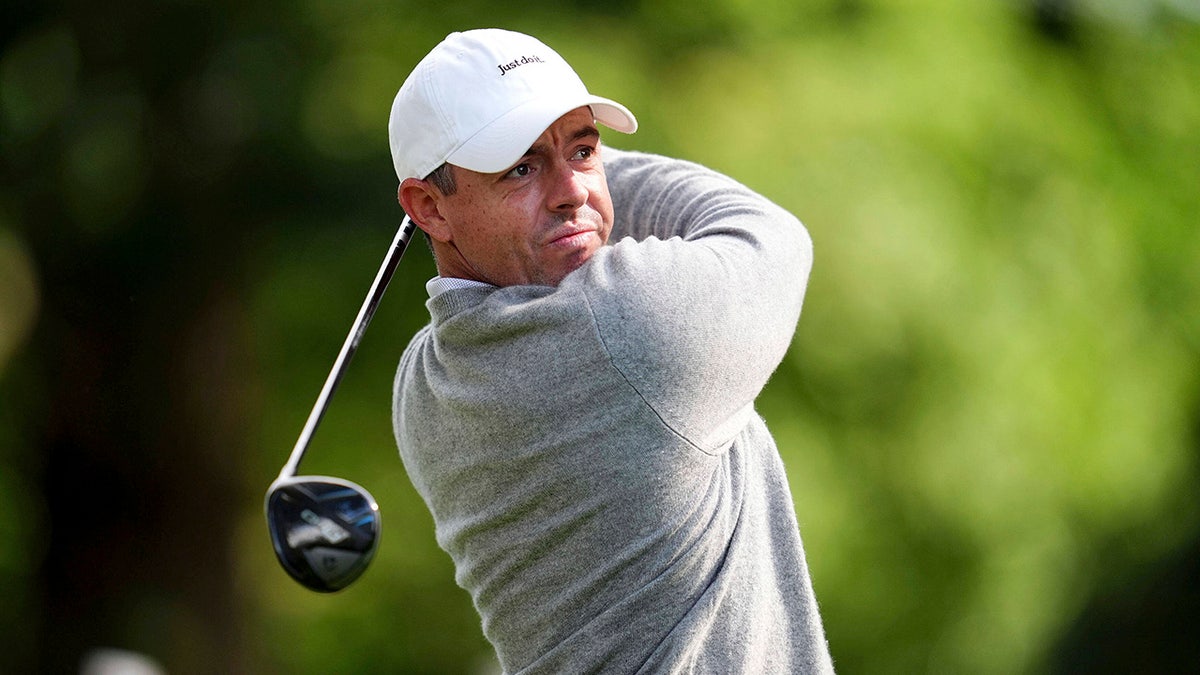 Rory McIlroy looks on with driver