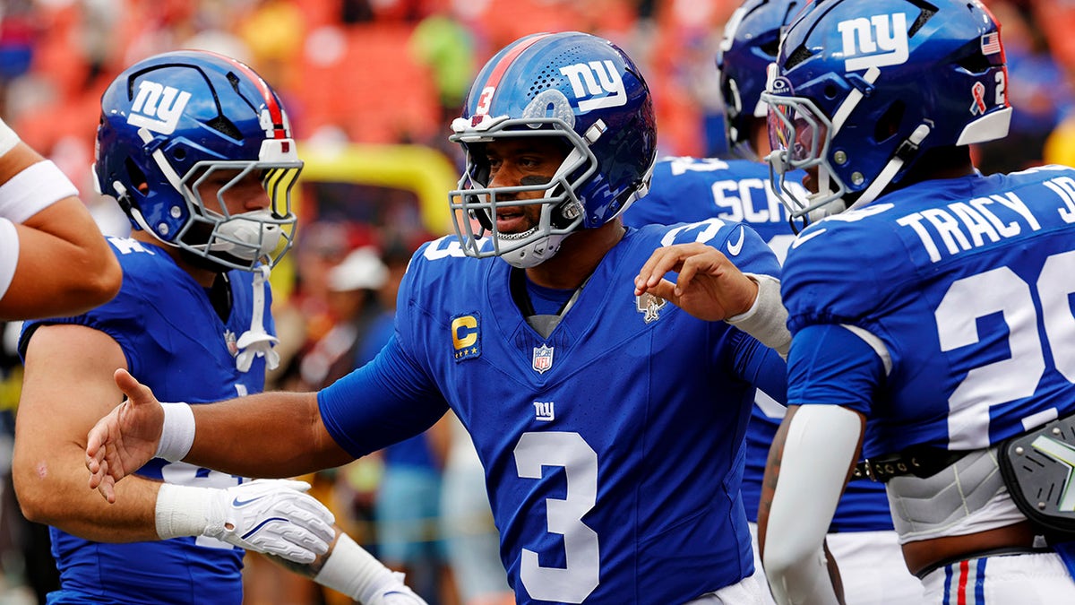 Wilson throws during the loss to Washington